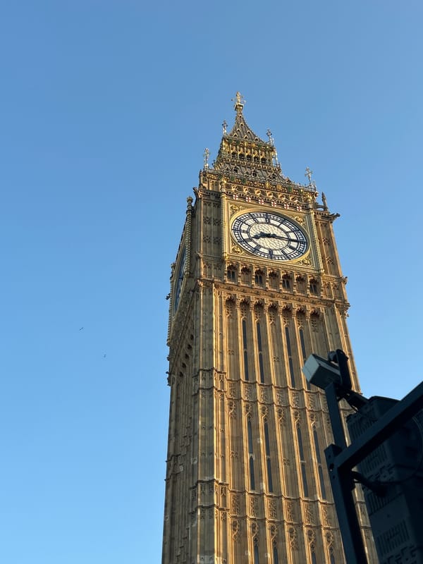 Tourist captures Westminster landmarks during London afternoon walkabout