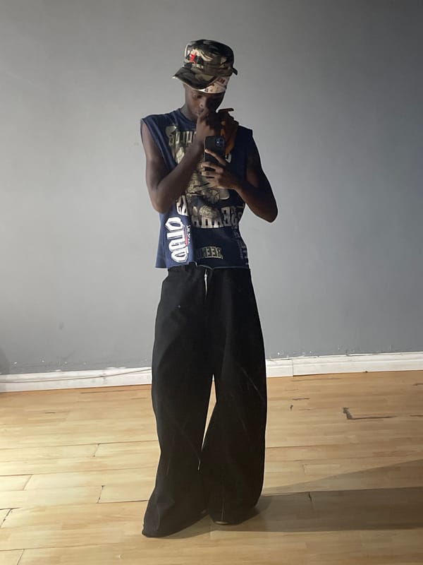 Person in camouflage hat observed at indoor Lekki location