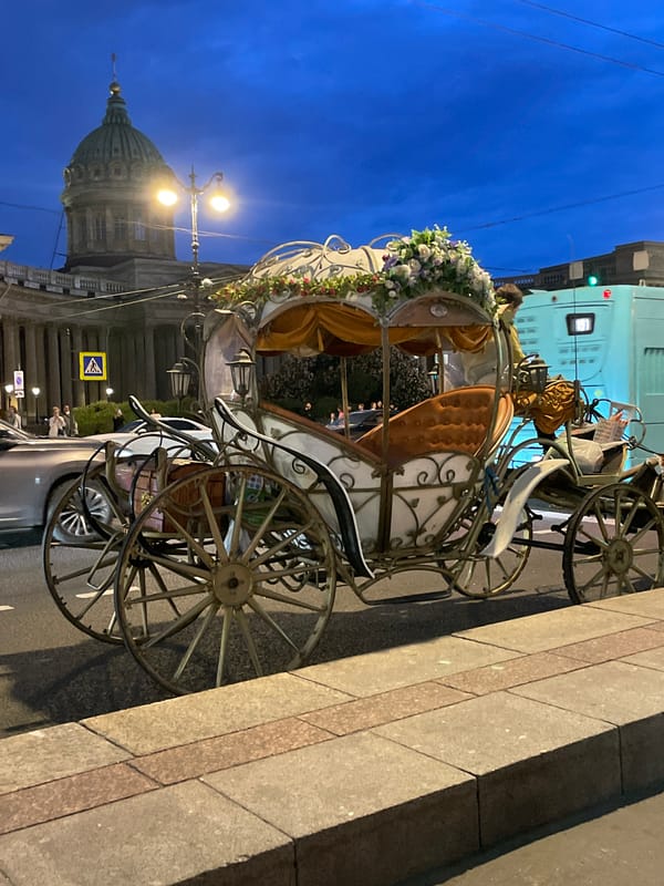 Ornate flower-decorated carriage spotted parked at dusk