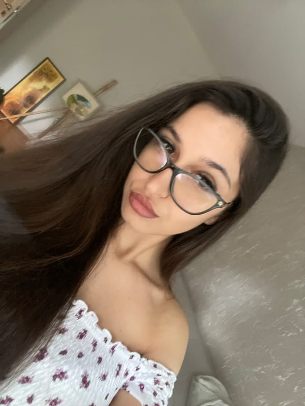 Selfie session on the couch in a floral off-shoulder top