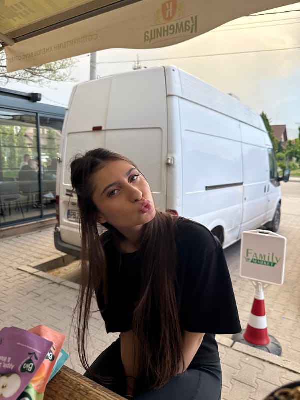 Woman photographed with purple item near van in Plovdiv