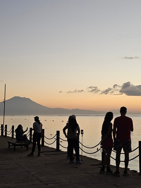 Evening crowds gather at Denpasar waterfront for sunset viewing