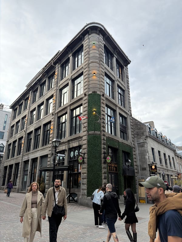 Stone building with greenery documented in Montreal street scene