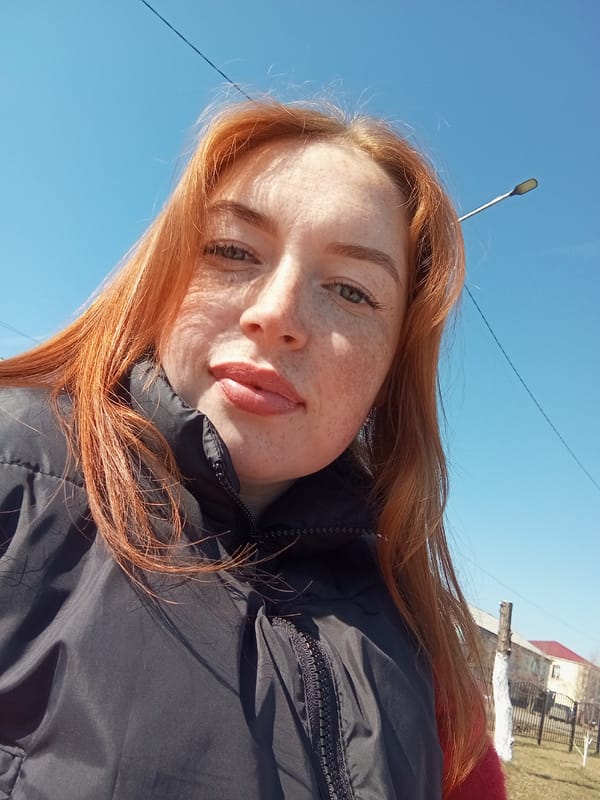 Woman Takes Morning Selfies with Coffee in Russian Town