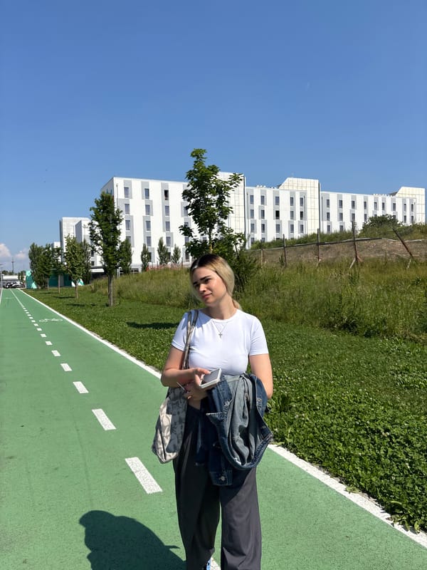 Woman stands on green path in Novate Milanese