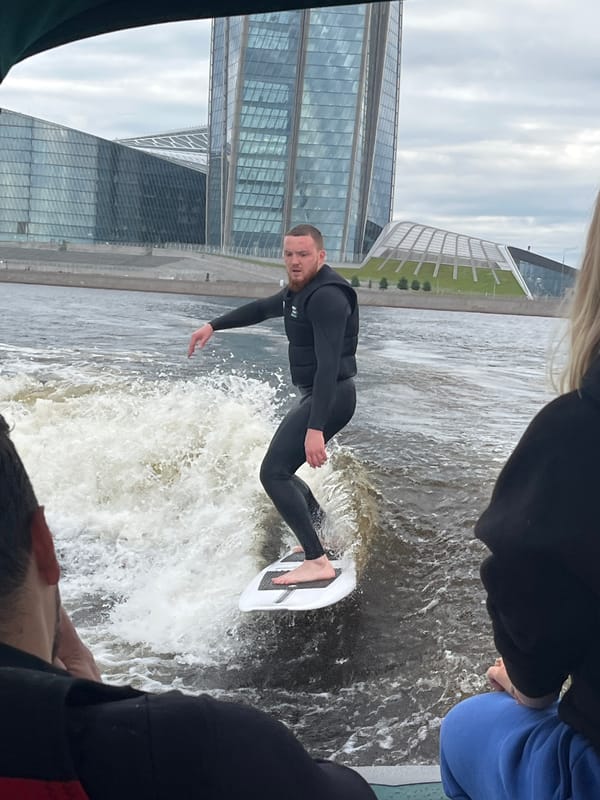 Wakeboarding the Neva River with Saint Petersburg's skyline behind