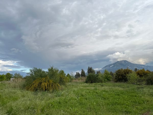 Girl enjoys snack in gazebo amid Fethiye's spring landscape