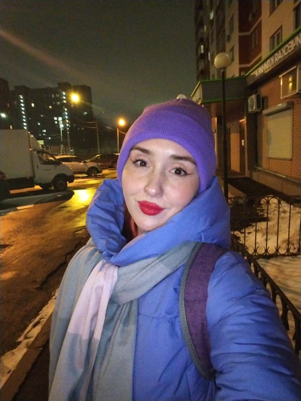 Woman in winter attire spotted in Izhevsk evening scene