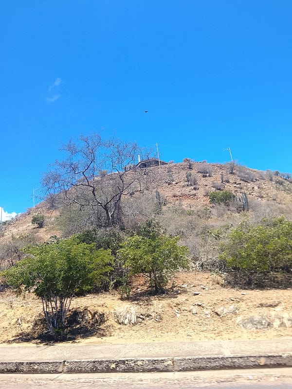 Motorcycle rider documents sunny afternoon journey through Juan Griego