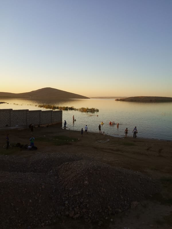 Waterfront gathering at golden hour, multiple angles