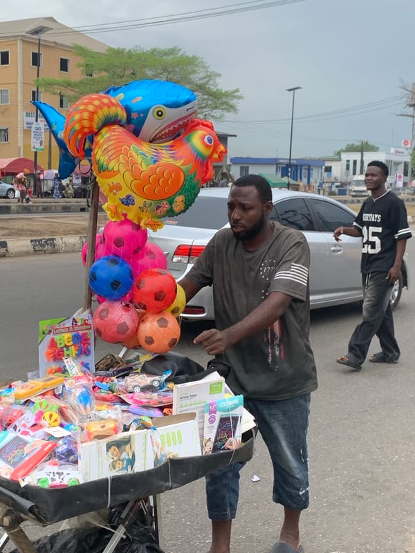 Street vendors sell produce in Ikorodu marketplace