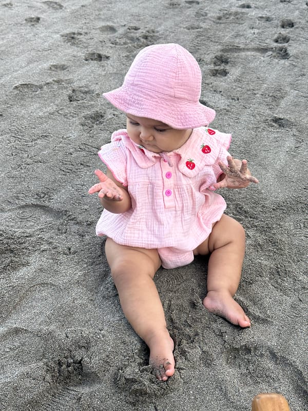Baby and Traditional Offering Observed on North Kuta Beach