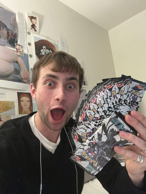 London resident photographs self with Pokémon card packs