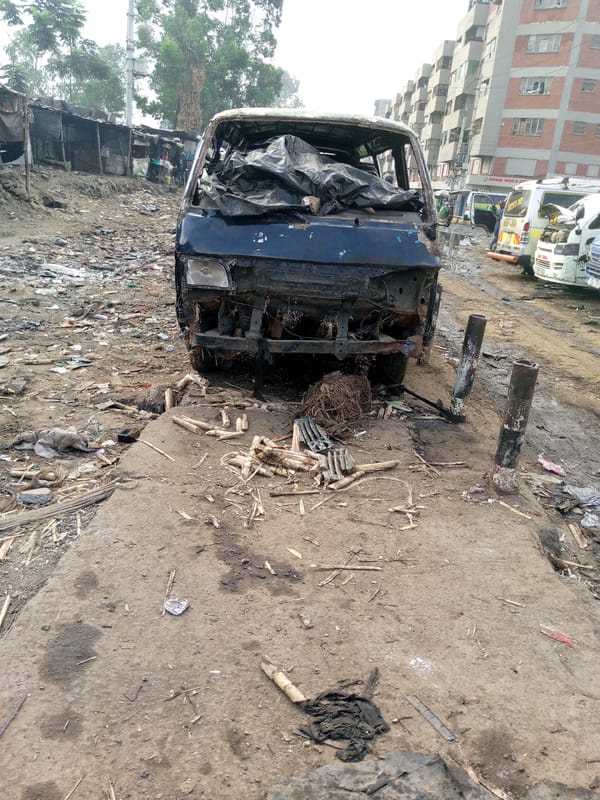 Severely damaged minibus with charred interior observed in Nairobi