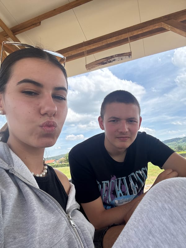 Two people take selfie outdoors in Karavelovo, Bulgaria