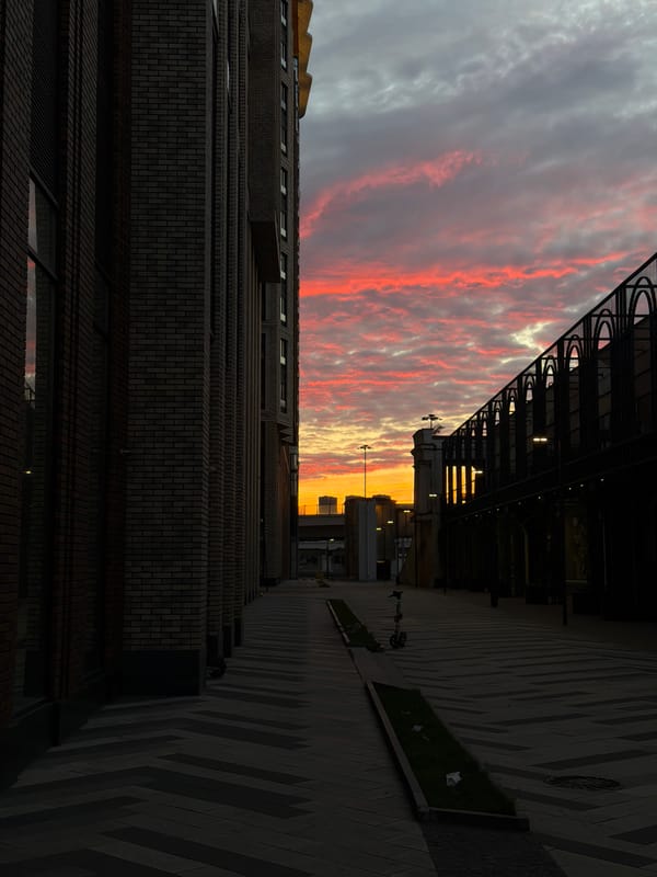 Dusk falls between modern brick buildings in Khimki, Russia