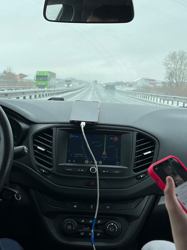 Driver navigates wet highway in Kitsjanovo, Russia