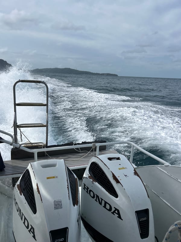 Boat ride through Ao Nang's karst waters with a travel post graphic