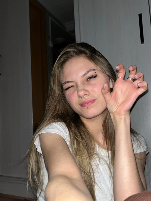 Woman takes selfie indoors in Foki, Russia