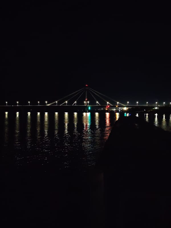 Nighttime scenes captured in Cherepovets show illuminated bridge, Ferris wheel