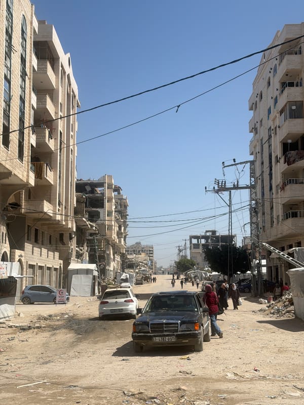 Gaza street shows damaged buildings, scattered debris