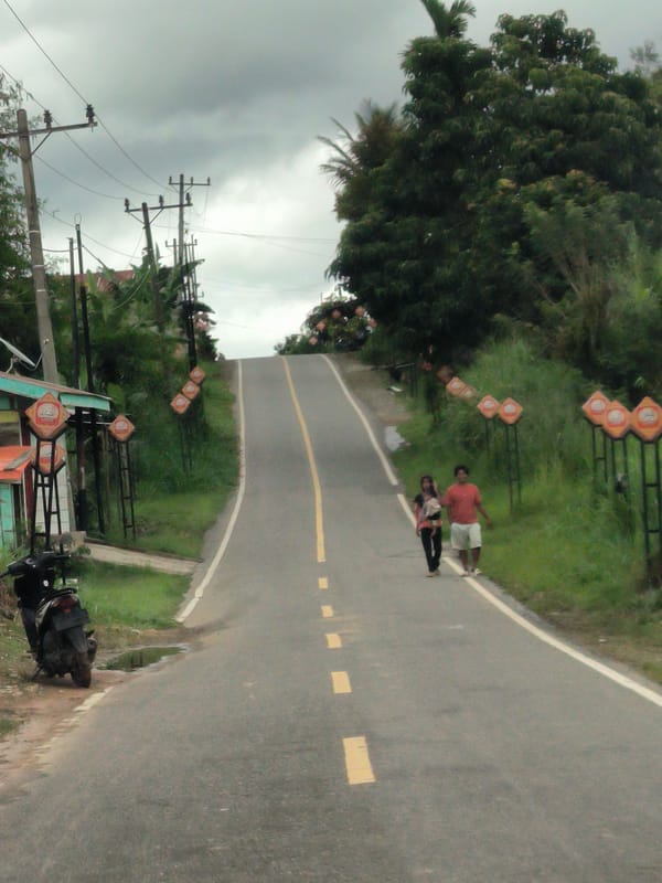 Overcast roads and forested hills in rural Aceh, Indonesia