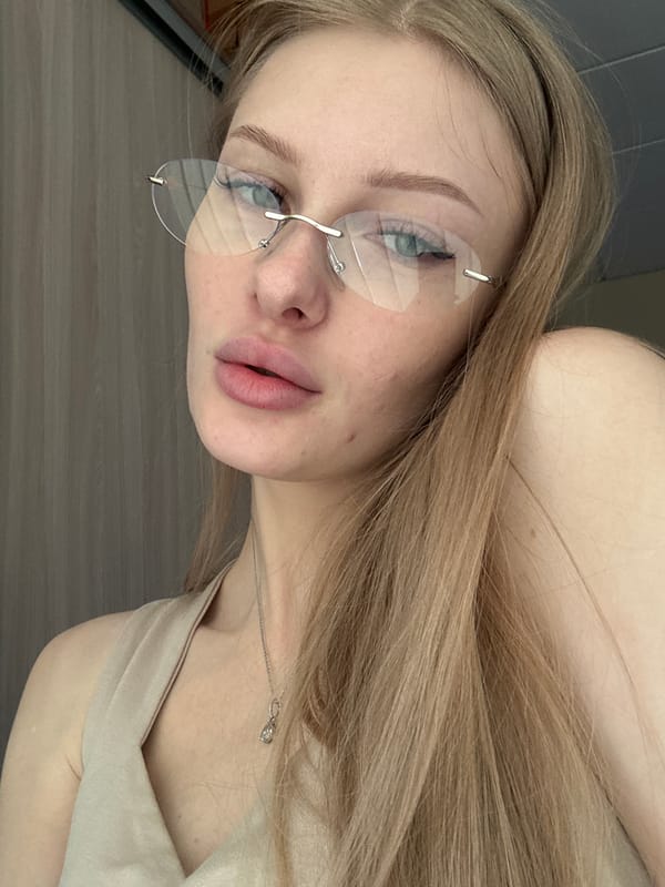 Young woman photographs herself in Perm, Russia morning session