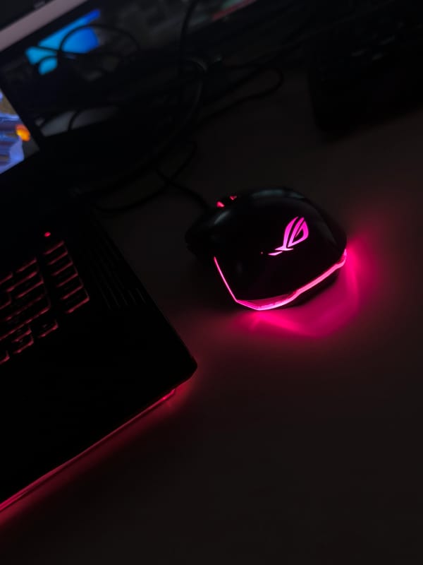 Gaming setup with pink RGB lighting captured in Sofia