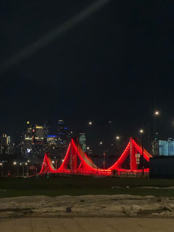 Red illuminated bridge observed at night in Moscow
