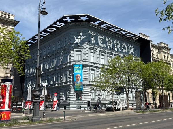 Visitors document House of Terror museum and Iron Curtain Memorial