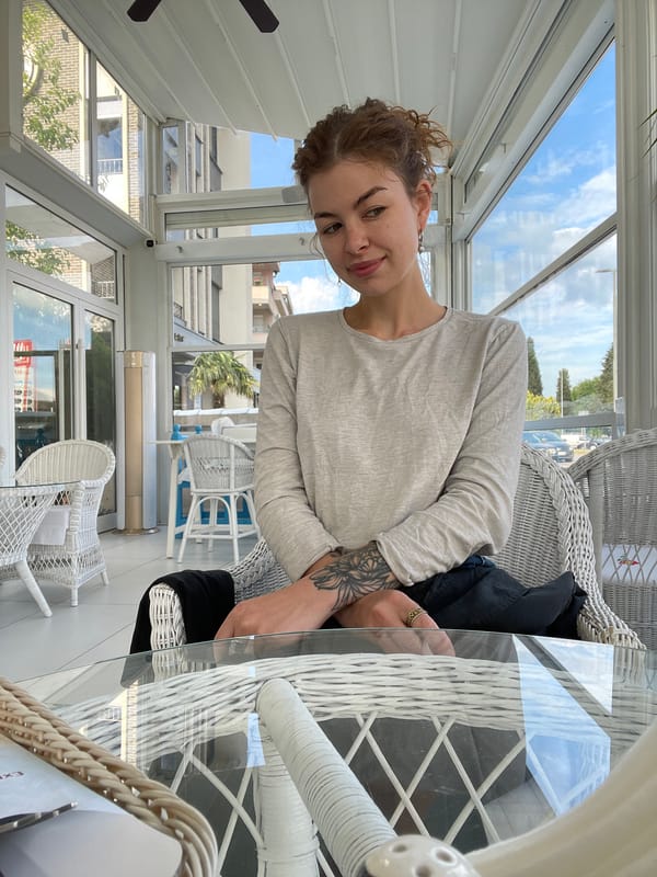 Woman enjoys early morning cafe visit in Podgorica