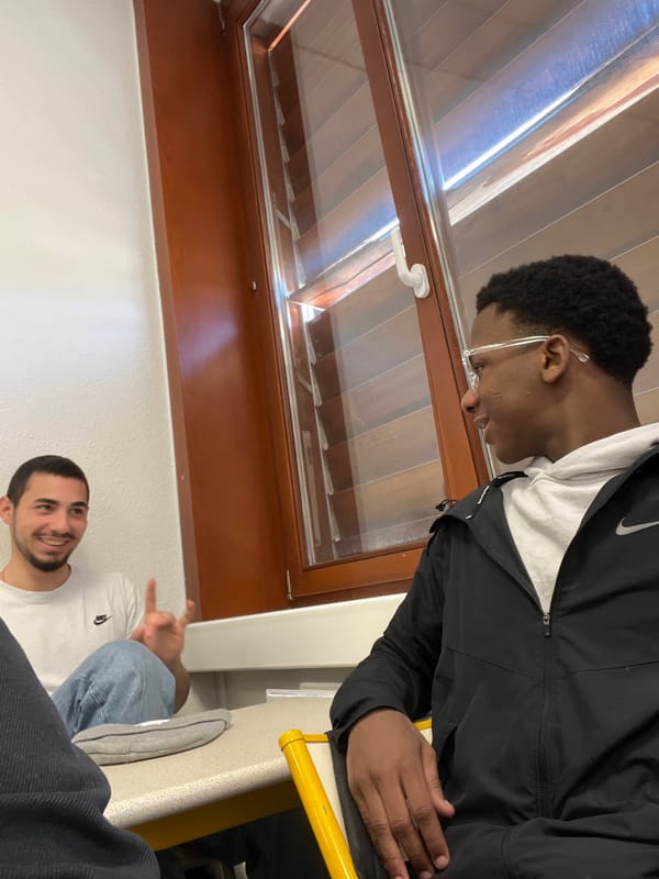 Young men take selfies during casual meetup in Schiltigheim