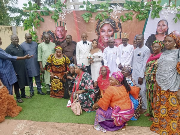 Wedding celebration held in Kitwe, Zambia with guests photographing