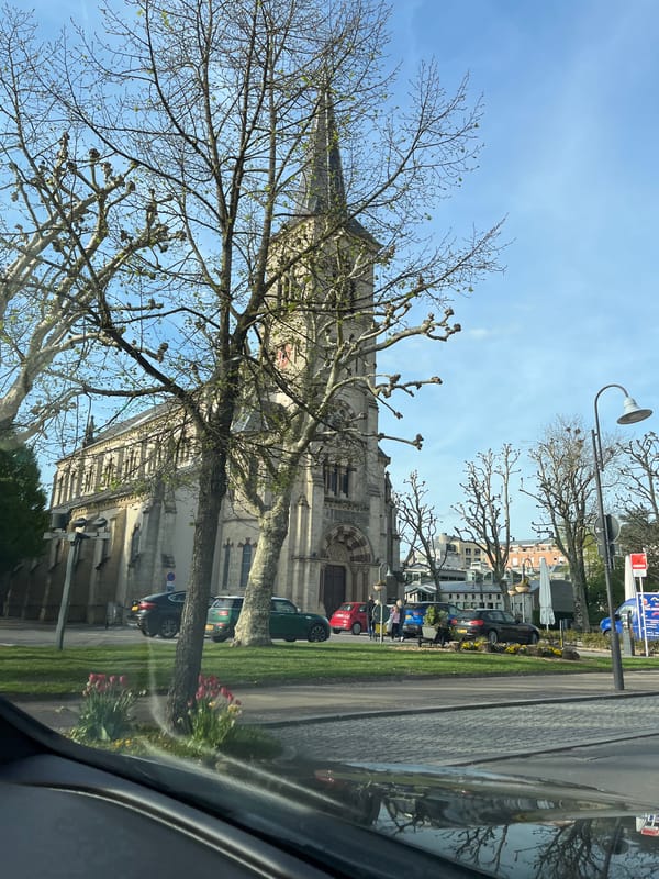 Church photographed from vehicle in Bettembourg, Luxembourg