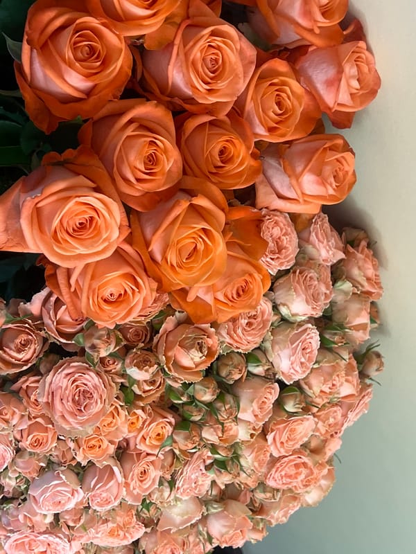 Rose arrangement displayed in Yerevan features orange and peach blooms