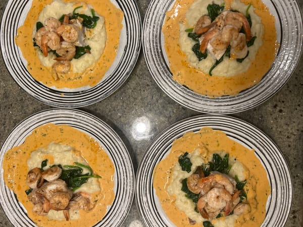Four identical plated meals documented in Whistler dining setting