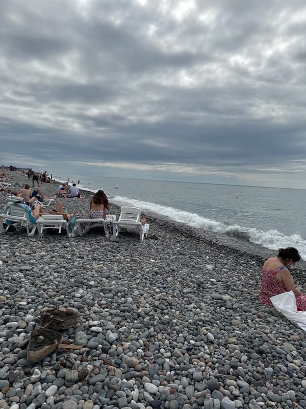 Overcast afternoon on Batumi's busy pebble beach