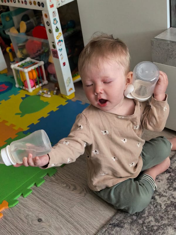 Toddler plays with bottles, toys in Sterlitamak home