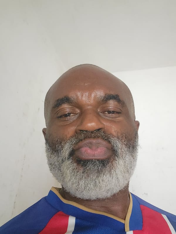 Man poses for photos in Maiburiji wearing sports jersey