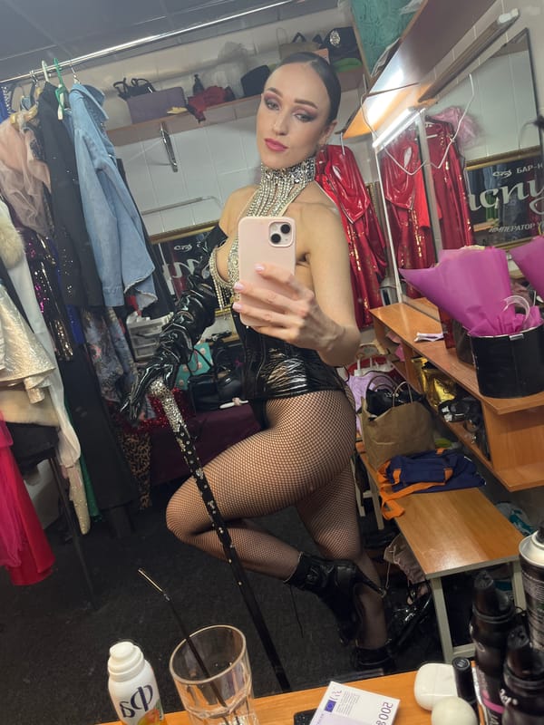 Performers in costume document backstage moments in Kazan dressing rooms