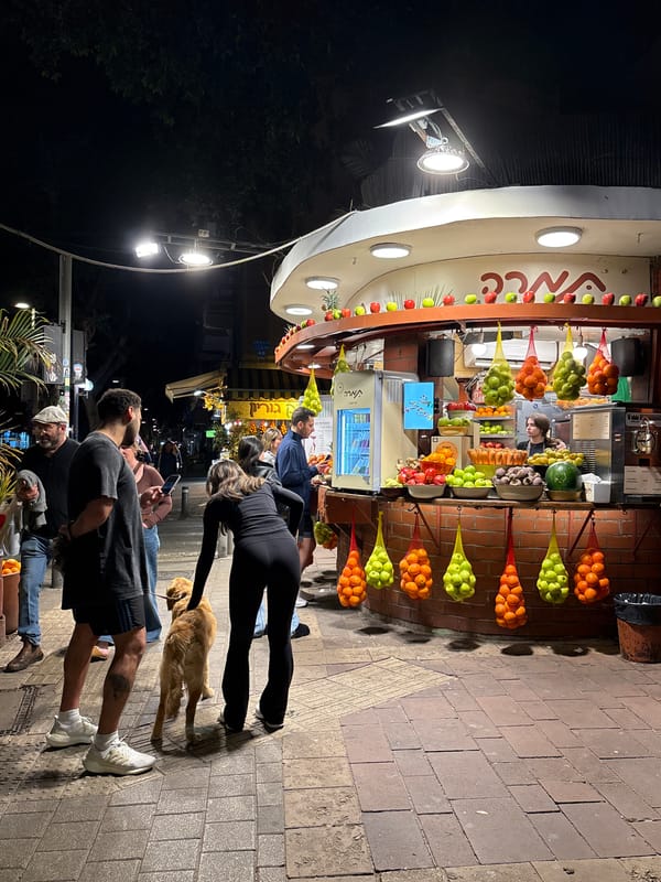 Street fruit vendor operates in Tel Aviv evening