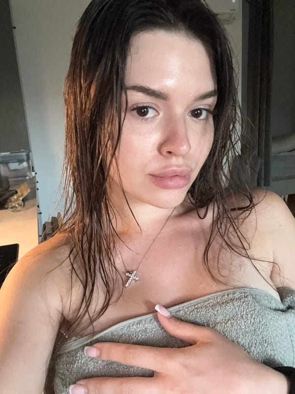 Post-shower selfie, wet hair and grey towel.