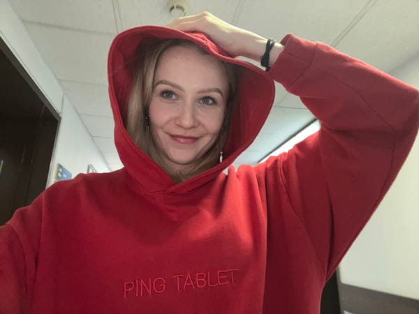 Woman in red hoodie photographed indoors in Khimki