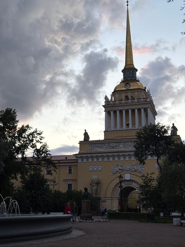 Saint Petersburg's Admiralty spire under a stormy evening sky