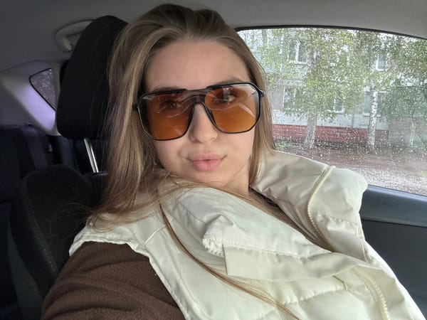 Person photographed in car during rainy morning in Omsk