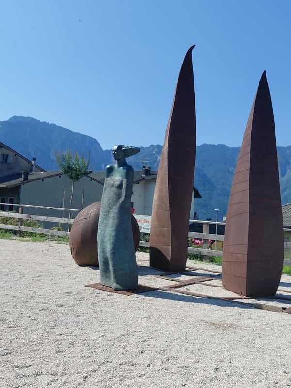 Morning stroll through Levico Terme's gardens and fountain square