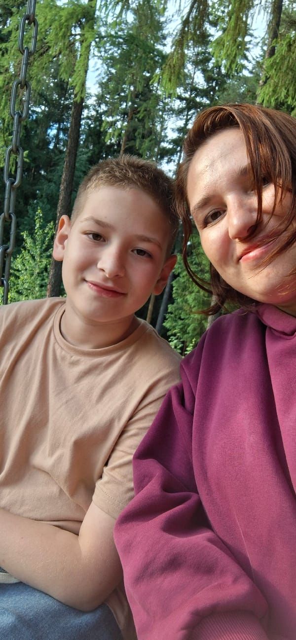 Family enjoys afternoon outing at wooded park in Прикамский