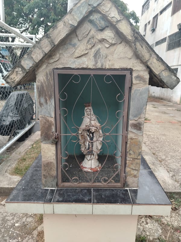Stone shrine with metal gate observed in Tinaquillo, Venezuela