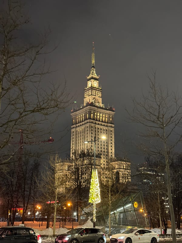 Warsaw's Palace of Culture illuminated during winter evening