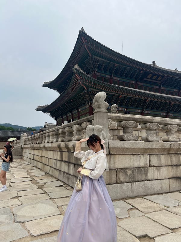Traditional dress worn at Seoul palace during overcast morning